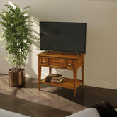 Mobile Porta TV classico con ribalta e ripiano in legno di noce tanganica. Un pezzo artigianale della collezione Tiziano che unisce eleganza intramontabile e praticità quotidiana.