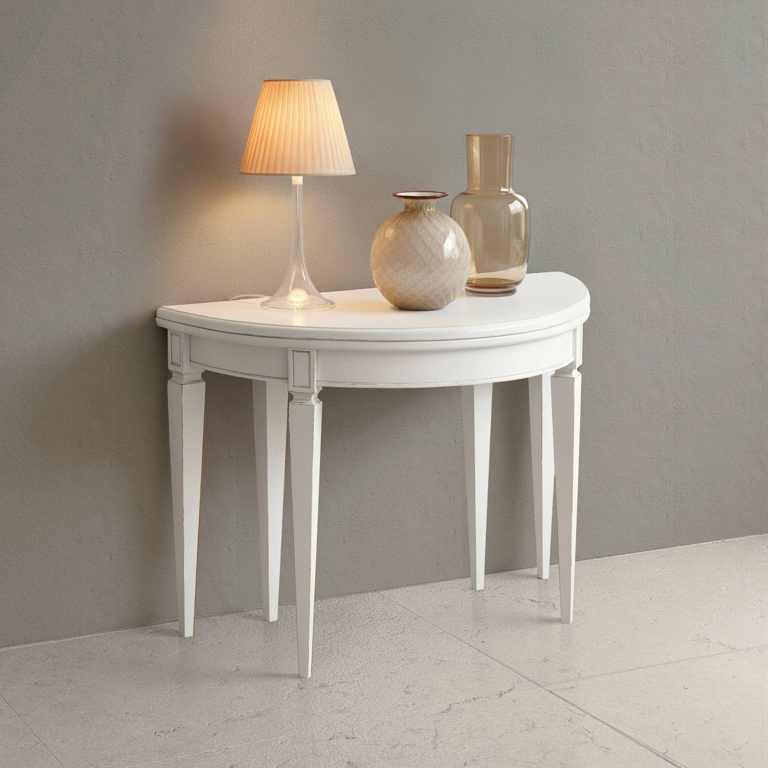 Console tavolo rotondo e ovale allungabile Tiziano in laccato bianco consumato anticato patinato, luminoso e raffinato per ambienti eleganti e contemporanei.
