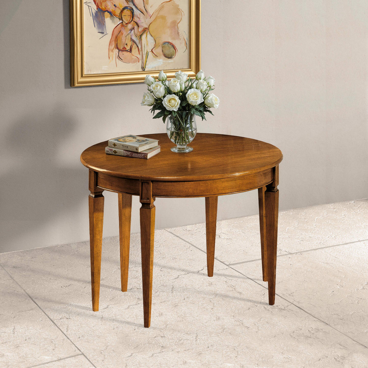 Console tavolo rotondo e ovale classico allungabile Tiziano in ciliegio, aperto nella configurazione rotonda: eleganza, solidità e convivialità artigianale.