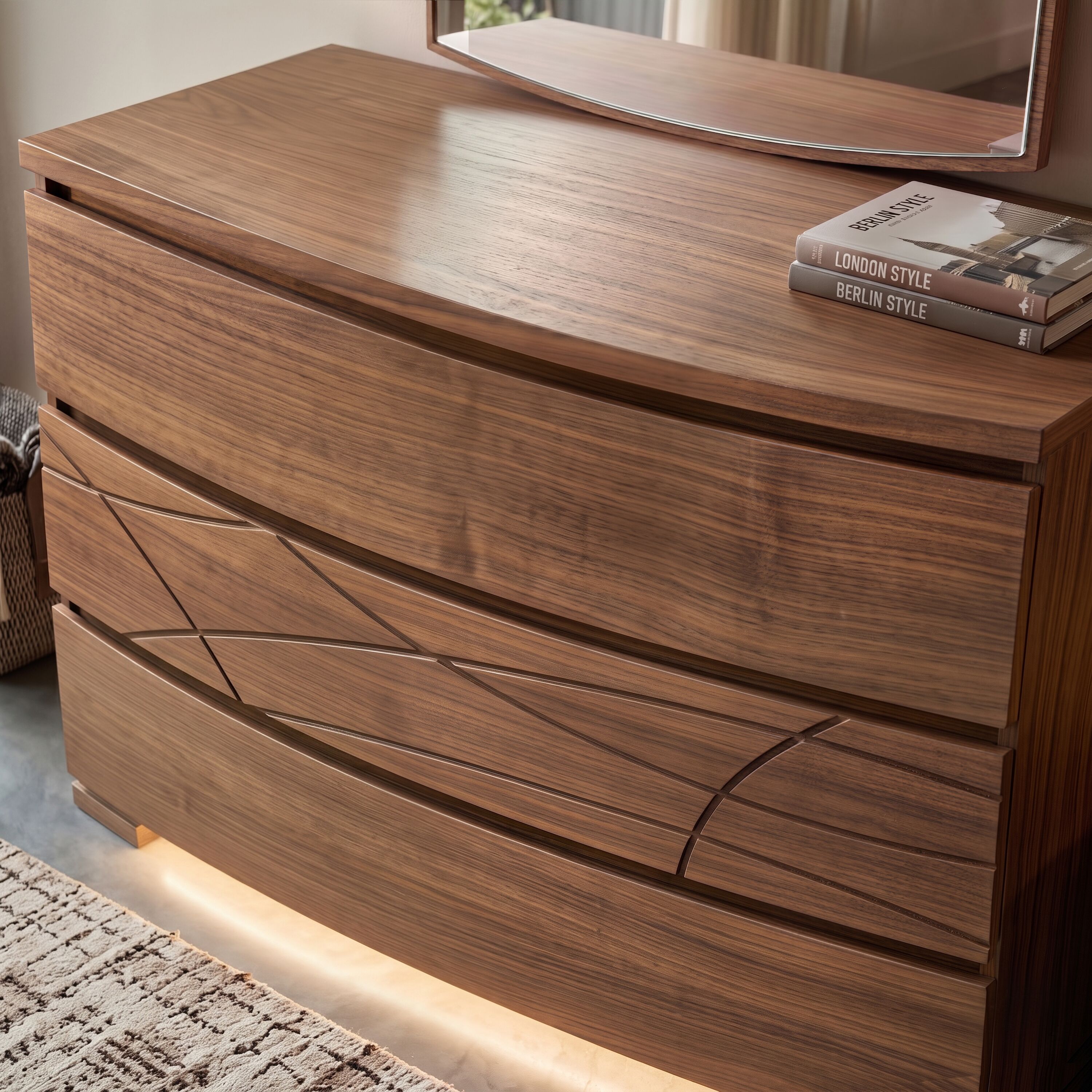 Comò contemporaneo Modigliani Piombini in vero legno di noce con specchiera coordinata e illuminazione LED integrata. Le forme sagomate, il disegno esclusivo dei frontali, le venature autentiche del legno e la luce soffusa esprimono l'equilibrio tra design italiano, innovazione e lavorazione artigianale.