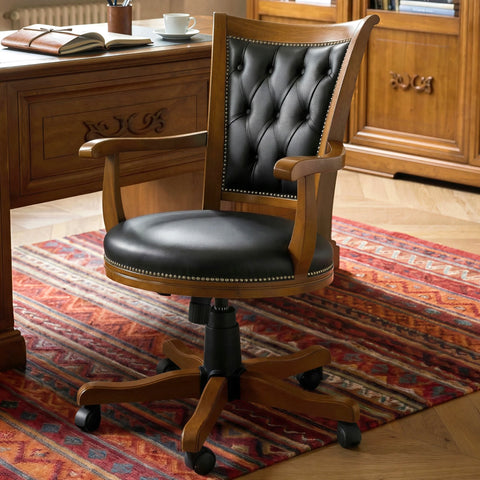 Poltrona girevole classica Tiziano RH170P con rivestimento in vera pelle capitonné, struttura in legno massello e lavorazione artigianale italiana Piombini.