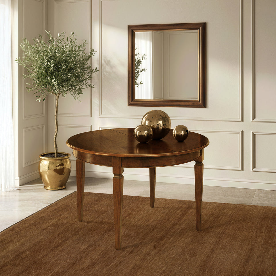 Mesa clásica redonda de madera extensible Tiziano RH311 diámetro 120 con extensión central. Una mesa elegante y acogedora, fácil de ampliar, sólida, refinada y perfecta para recibir a cada invitado.